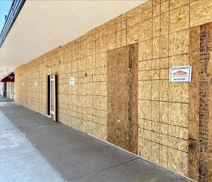 boarded up business with plywood